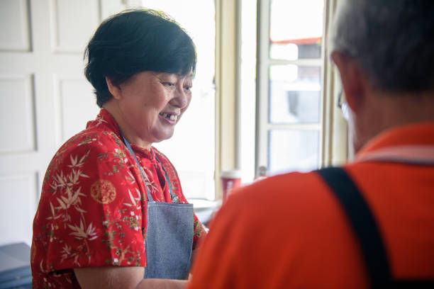 istock Senior couple enjoying cooking in the kitchen 1183778532