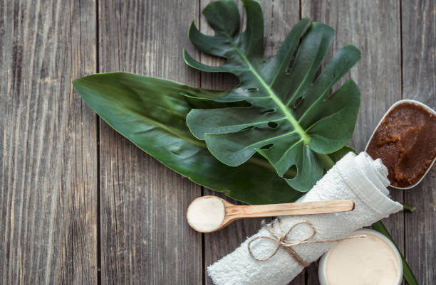 istock Spa composition with towels and tropical leaf on a wooden background. 1183779830