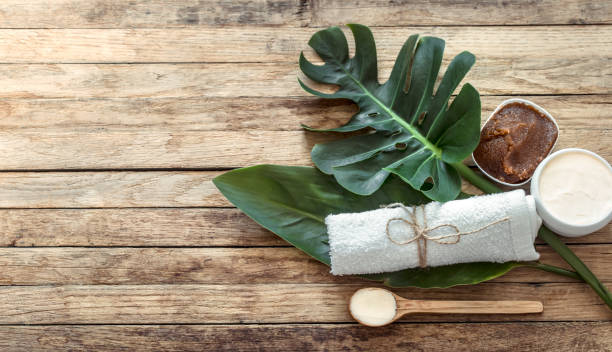 istock Spa composition with towels and tropical leaf on a wooden background. 1183779836