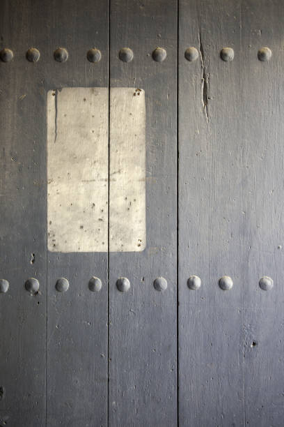 Wooden door with ancient lock, construction and architecture