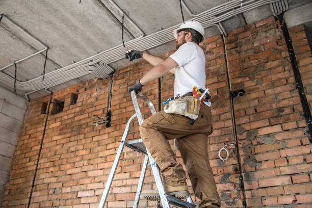 istock Electrician with tools, working on a construction site. Repair and handyman concept. 1183783612