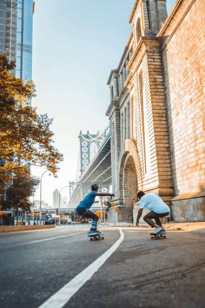skateboarders or skaters get together and play on the street in freestyle, celebrating world skateboard day. : Yogyakarta, Indonesia - 21 June 2023