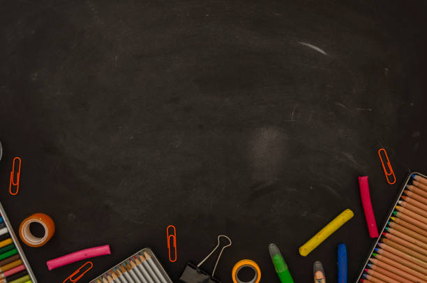 istock Back to school frame. Flat lay mockup tationery, notepads, pencils and clips over classroom blackboard with copy space 1183786462