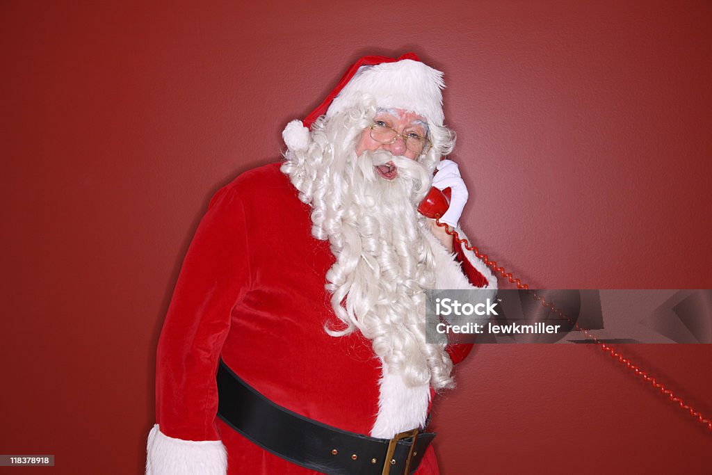 Santa parla al telefono - Foto stock royalty-free di Adulto