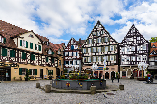 Schorndorf, Germany, October 10, 2019, Stunning old timbered houses at downtown schorndorf city marketplace surrounding a fountain, the city is also called the daimlerstadt