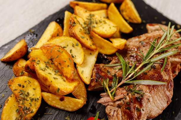 istock Pork chops in honey sauce with roasted potatoes 1183794985