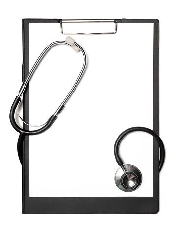 Stethoscope and black clipboard isolated on white