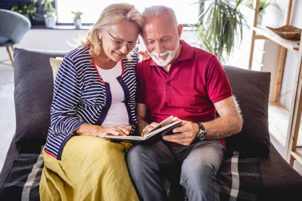 istock Senior couple looking at some old photos 1183797067