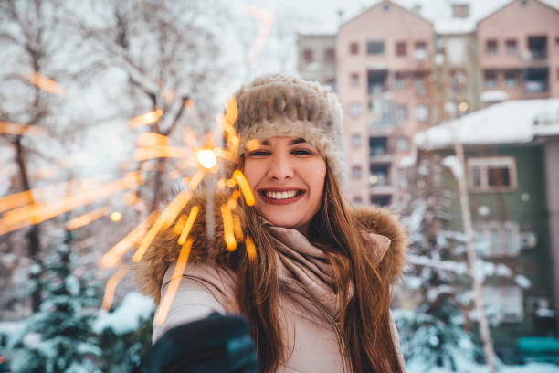 istock Young woman holding sparkler 1183798962
