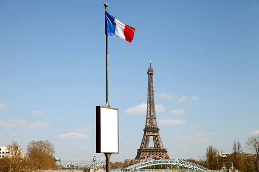 The French flag and the Eiffel tower in Paris