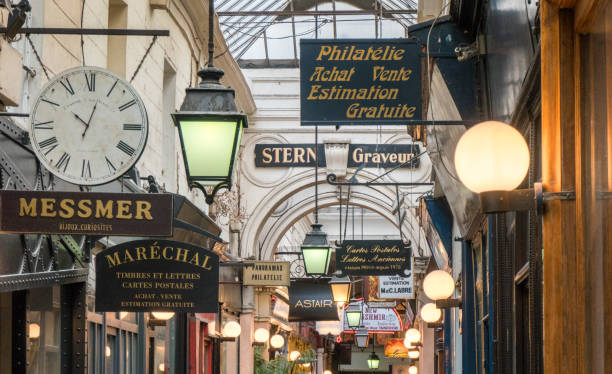 Shops and signs in a passage couvert (corridor, arcade, gallery). This is the so-called passage des Panoramas