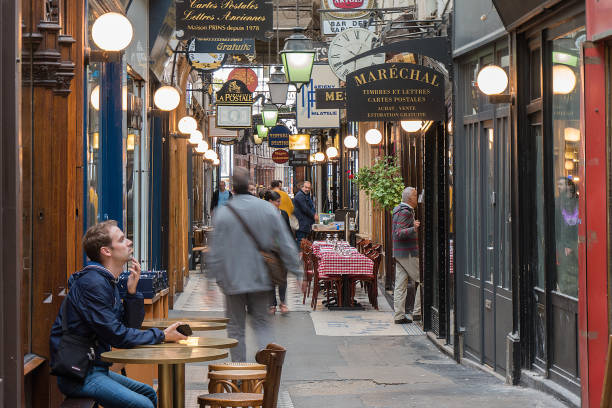 Shops and signs in a passage couvert (corridor, arcade, gallery). This is the so-called passage des Panoramas