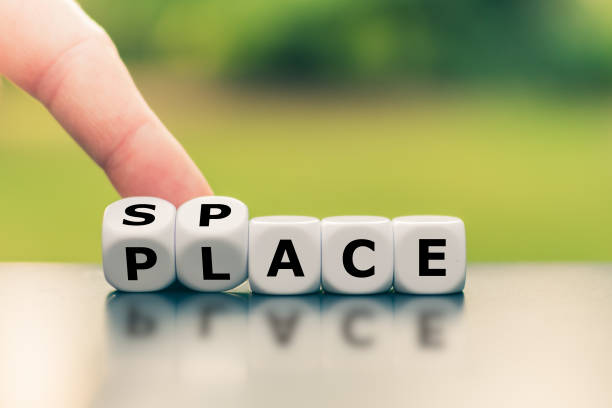 istock A place with space. Hand turns a dice and changes the word 