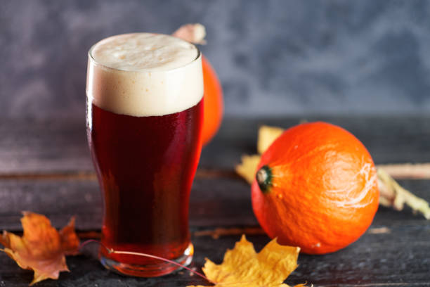 istock Pumpkin beer red ale glass on the table 1183800220