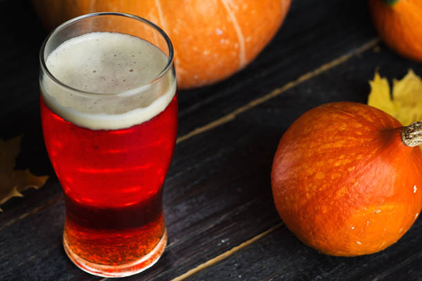 istock Pumpkin beer red ale glass on the table 1183800225