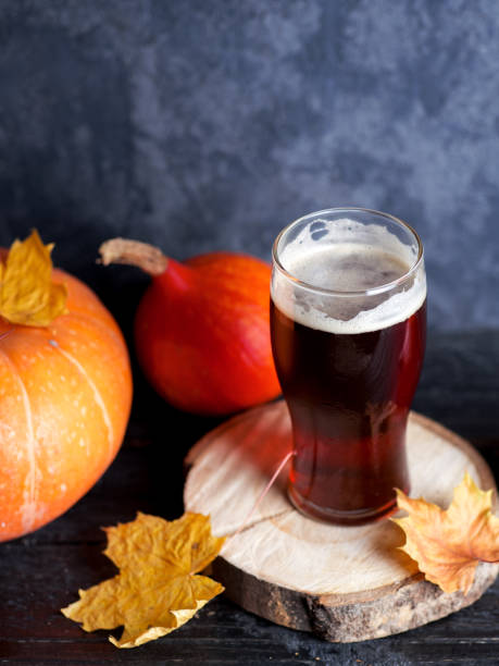 istock Pumpkin beer red ale glass on the table 1183800238