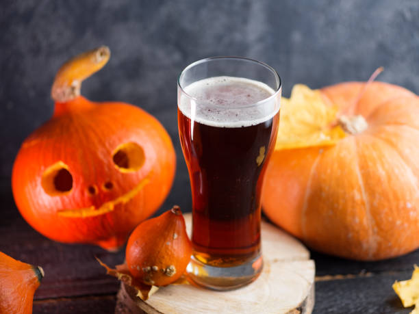 istock Pumpkin beer red ale glass on the table 1183800249