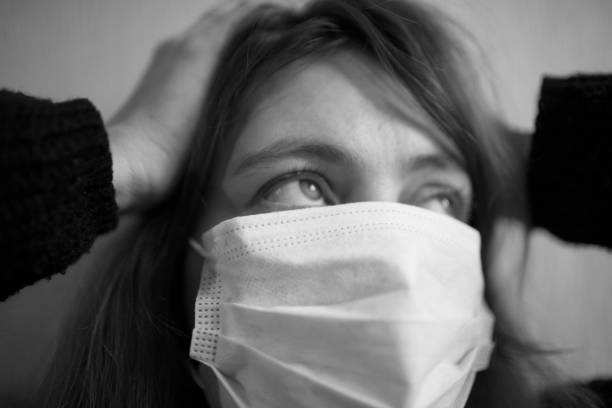 istock Woman in protective gauze mask 1183801522
