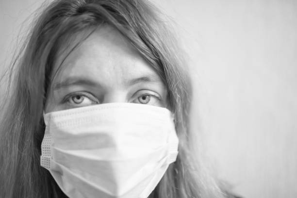istock Woman in protective gauze mask 1183801627