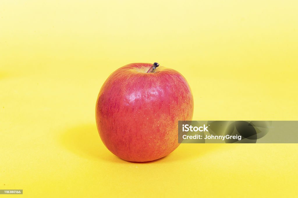 Czerwone jabłko - Zbiór zdjęć royalty-free (Barwne tło)