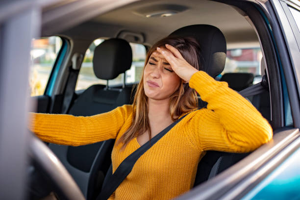 istock Nervous female driver sits at wheel 1183801821