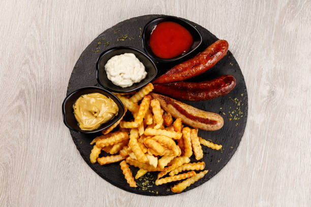 istock Delicious sausage served with fries 1183802464