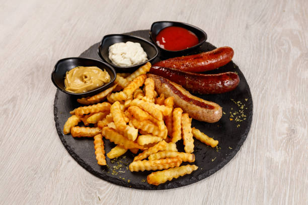 istock Delicious sausage served with fries 1183802493