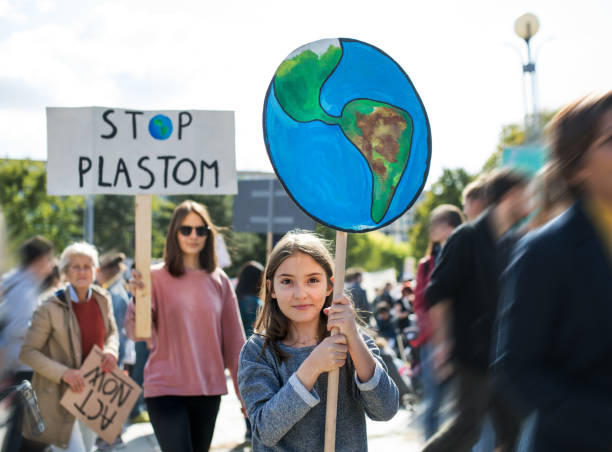 istock People with placards and posters on global strike for climate change. 1183805843