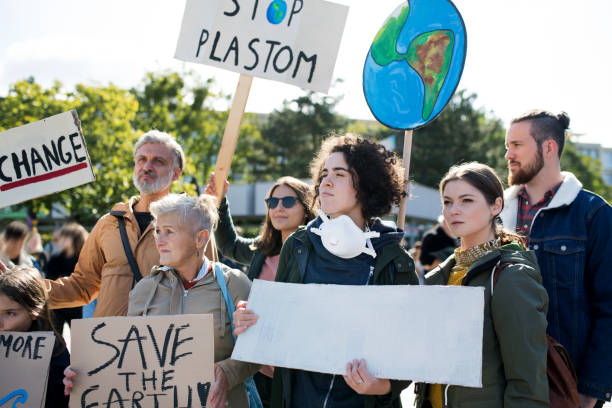 istock People with placards and posters on global strike for climate change. 1183805970