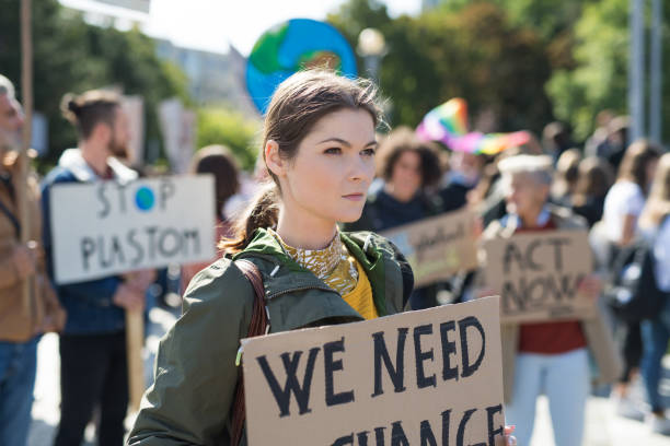 istock People with placards and posters on global strike for climate change. 1183805994