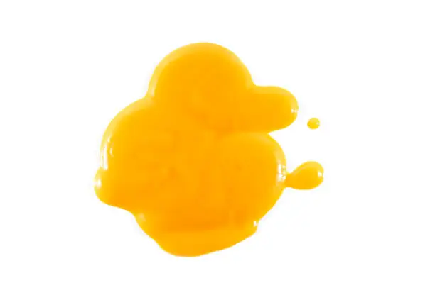 Mango Puree, Steam or Drop of Indian Mango Puree Isolated on white Background, top View