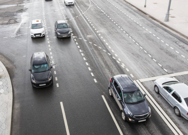 istock cars move along a multi-lane highway. 1183809770