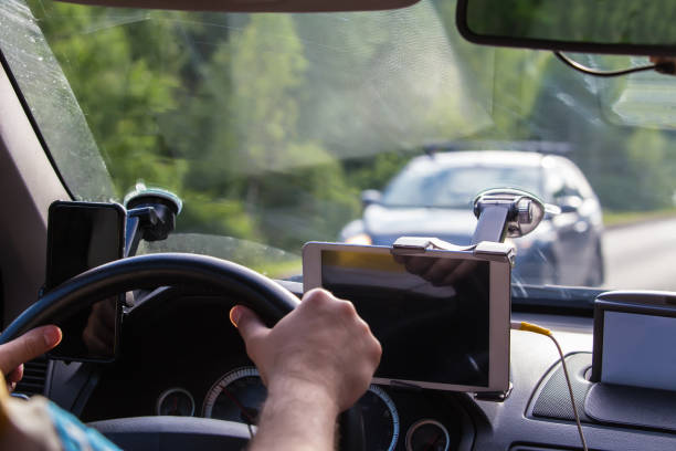 istock Driver in the car controls the navigator. 1183809970