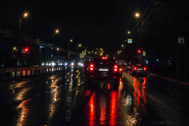 istock Car traffic at night on the avenue 1183809985