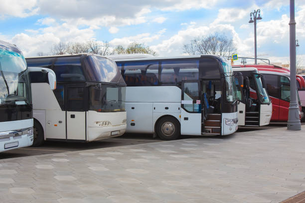 istock buses on parking on the background of cloudy sky 1183810006