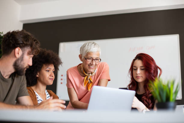 istock Senior businesswoman standing ant talking about project 1183810019