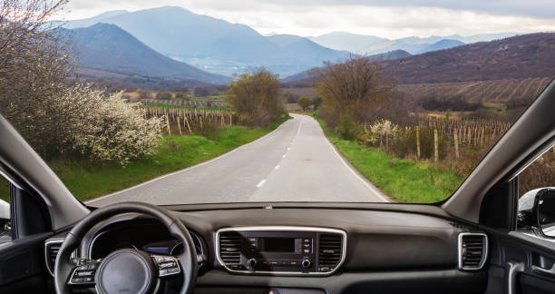 istock car going on the mountain road 1183810104