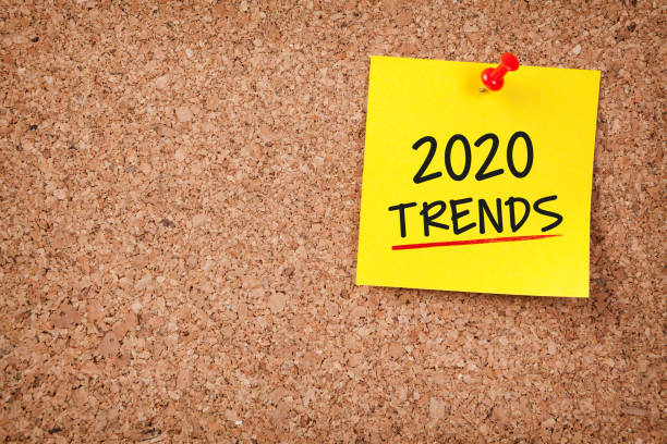istock Trends 2020 Word in Yellow Sticky Note on Cork Board 1183811890