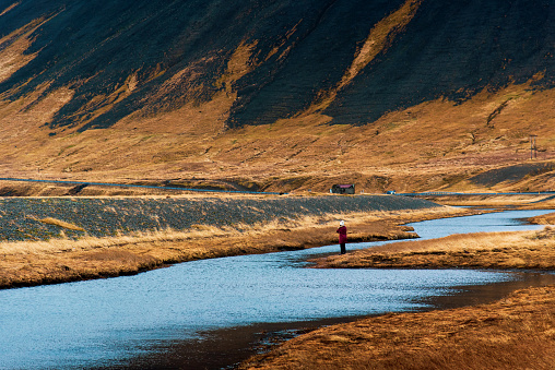 Woman enjoying stunning Icelandic scenery on Iceland trip