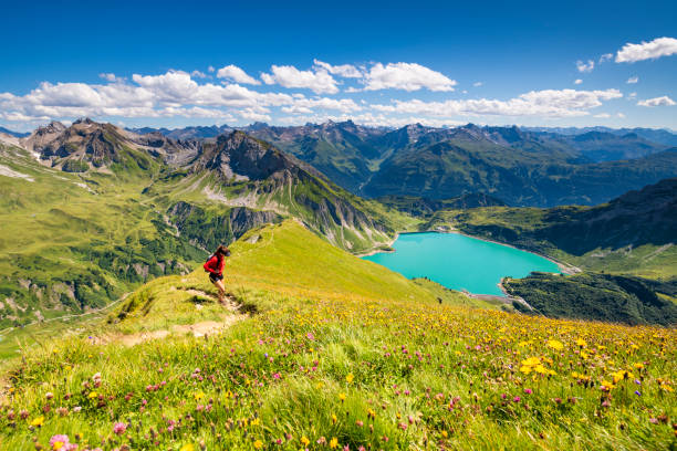 Awesome view from the mountain Spuller Schafberg to the Lechquellen mountains and the lake Spullersee at the Lech valley in the Alps in Vorarlberg, Austria.