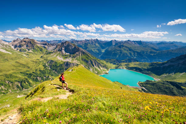 Awesome view from the mountain Spuller Schafberg to the Lechquellen mountains and the lake Spullersee at the Lech valley in the Alps in Vorarlberg, Austria.