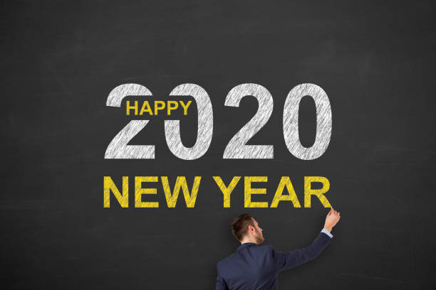 istock Happy New Year 2020 on Blackboard Background 1183816962