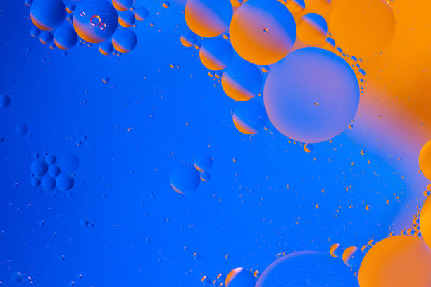 istock oil in water abstract micro bubbles gradient blue-orange space background 1183821271