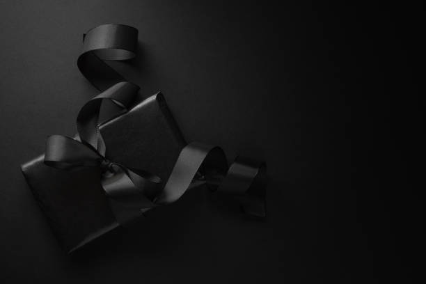 Black gift on dark background stock photo
