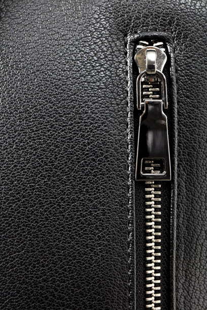 istock Zipper on black briefcase close-up (faux leather texture) 1183823151
