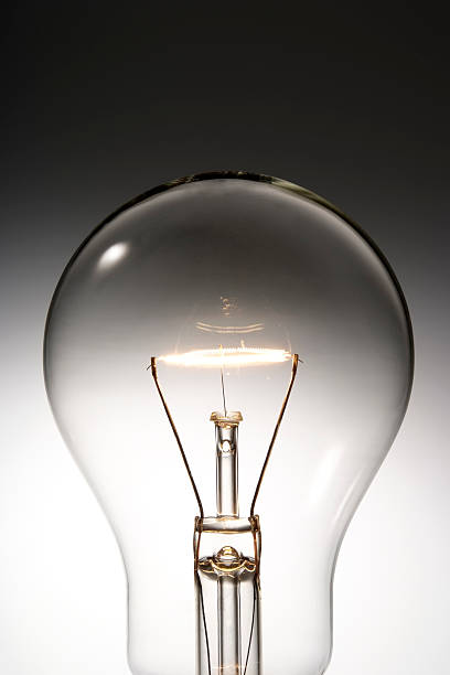 istock Close-up of illuminated light bulb against gradation background 118382659