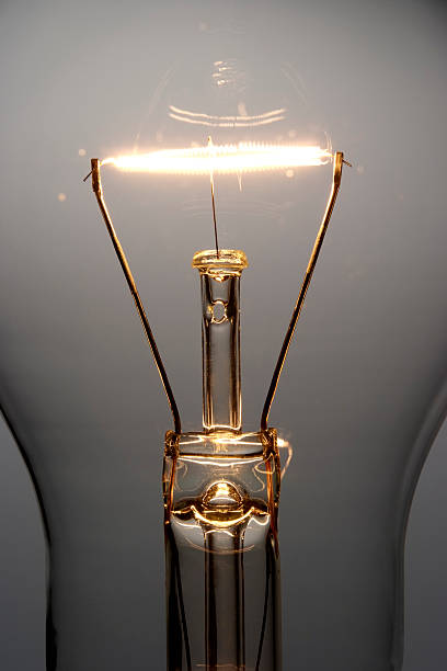 istock Close-up of illuminated light bulb against gradation background 118382722