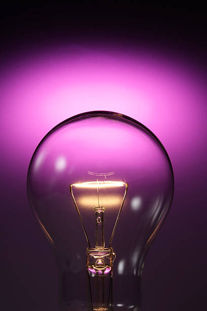 istock Close-up of light bulb against purple background with copy space 118382786