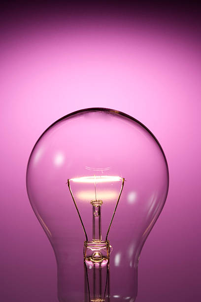 istock Close-up of light bulb against purple background with copy space 118382798
