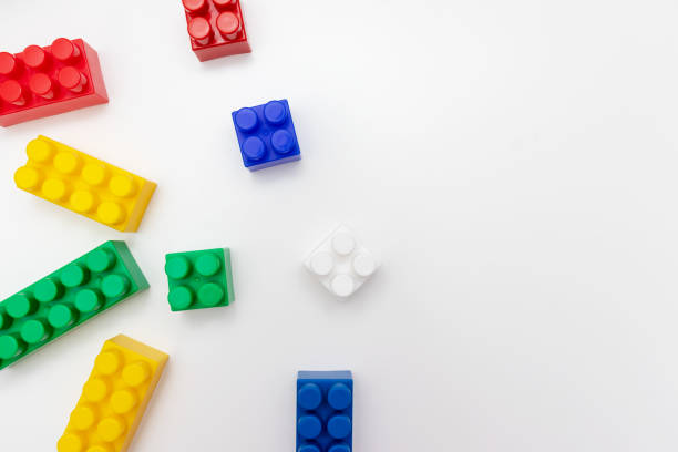 istock Many colorful toy plastic bricks, kit of blocks for building and constructing on white background with copy space 1183831081